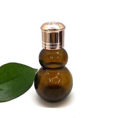 China Straight Double Gourd Essential Oil Recyclable Tan Glass Bottle Manufacturers Best Sales for sale