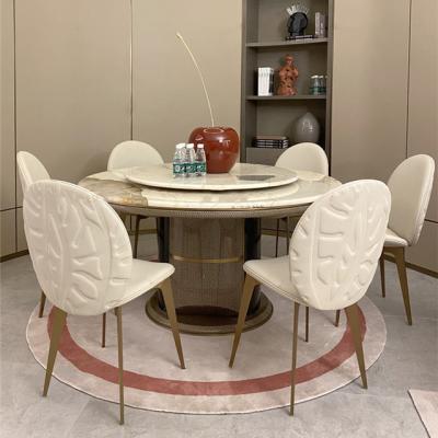 China Convertible modern stylish dining table with marble top dining table set with leather embroidery dining chair for sale