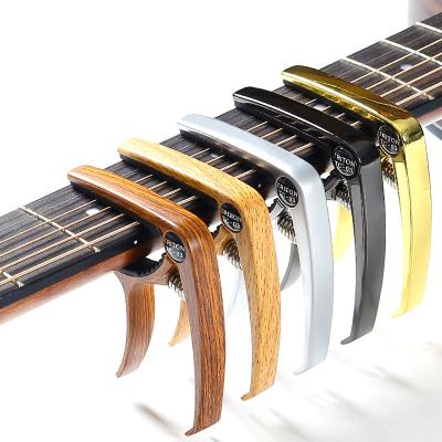 China FYCW High-effective Cradle Style Acoustic Guitar Capo Guitars Accessories Modify Tone Adjust Guitar Capo for sale