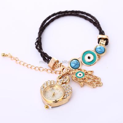 China 2018 Fashion New Style Alarm Palm Fashion Palm Evil Eyes Chain Bracelet Blue Heart Hand Watch for sale