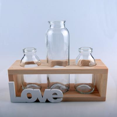 China Europe Medium Creative Hydroponic Plant Vase Wooden Frame Clear Glass Vase for sale