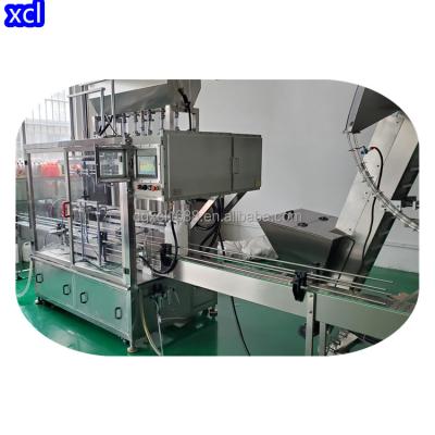 China Small Scale Manufacturing Semi Automatic Aerosol Filling Machines Spray Filling Packing Machine for sale