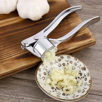 China Viable Home Use Stainless Steel Zinc Alloy Kitchen Accessories Manual Hand Garlic Crusher for sale