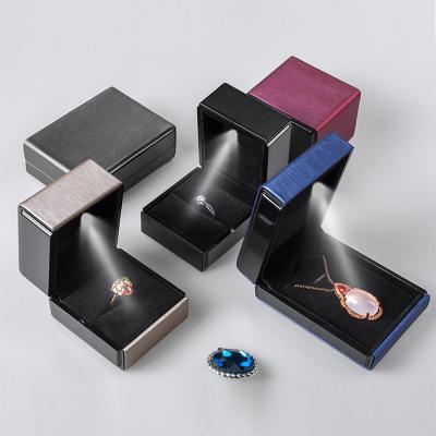 China Fashionable Creative Ring Box Jewelry LED Lamp Luxury Necklace Bracelet Packaging Brushed Leather Jewelry Box Necklace Box for sale