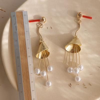 China BOHEMIA Long Tassel Earrings Exaggerated Metal Earrings Skirt Shape Alloy Pearl Earrings for sale