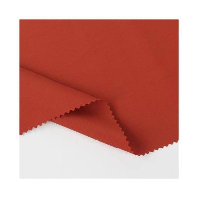 China Waterproof Wholesale 4 way stretch nylon fabric solid color plain dyeing fabric decoration red christmas fabric for sale