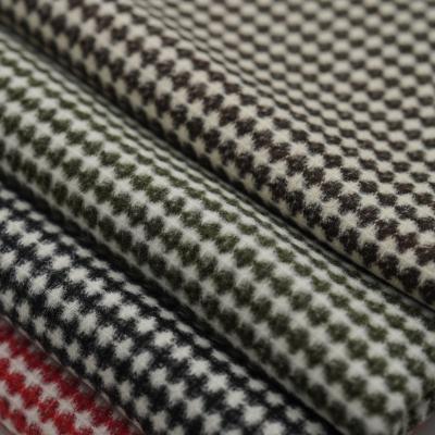 China Viable stain, 550-600g texture control overcoat small jacquard woolen fabrics, thick autumn and winter coat clothing woolen woolen fabrics for sale