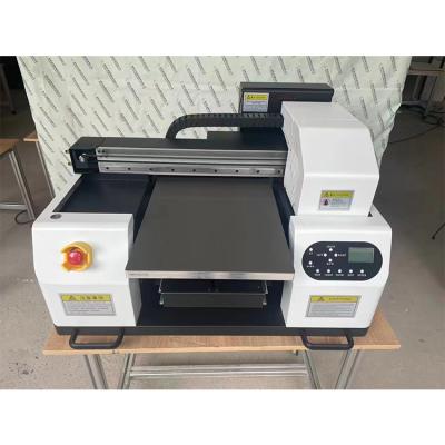 China Hotel Factory Supply Good Price UV Printing Machine High Quality Mini Desktop DTF UV Flatbed Printer With Vanish Printing for sale