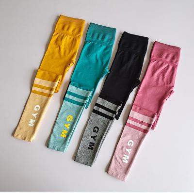 China Anti-Static Women Fitness Yoga Pants High Waist Sport Leggings Gym Pants Workout Letter Seamless Yoga Leggings for sale