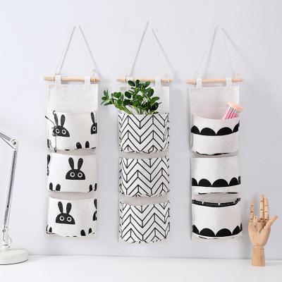 China Viable Waterproof Cotton Storage Bag Wardrobe Makeup Makeup Toy Storage Organizer Wall Hanging Canvas Bag for sale