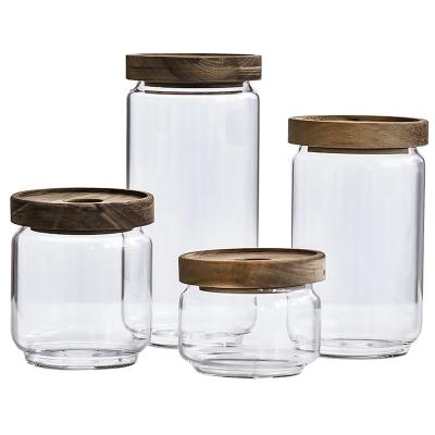 China Multifunctional Stackable Kitchen Food Storage Jars 450Ml 750Ml 950Ml 1550Ml Clear Glass Stackable Storage Jars Set With Acacia Wood Lid for sale