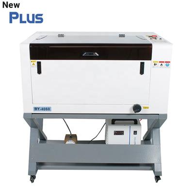 China High Precision 60w 80w Water Cooled Plywood Acrylic Leather Marking CO2 4060 6090 Laser Engraving And Cutting Machine Price for sale