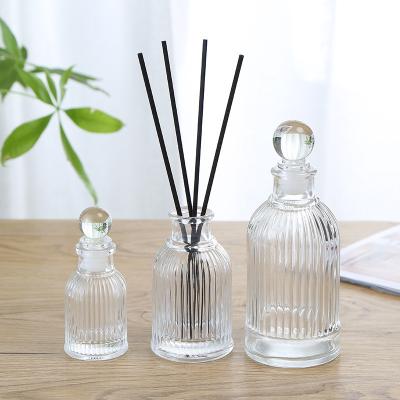 China 150ML Fashion Cosmetic Wholesale Cylindrical Vintage Engraving Aromatherapy Glass Thick Bottom Bottle for sale