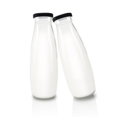 China Wholesale 200ml 250ml 500ml 1000ml high white round environmental friendly glass milk bottle with metal lid for sale