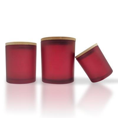 China Unique empty household products 210ml 300ml 420ml red color candle fancy empty glass jar with bamboo lid for sale