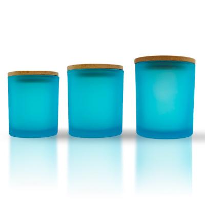 China Gift & Hot sale 210ml 300ml 430ml craft custom empty frosted blue glass candle holder candle jar with lid for sale