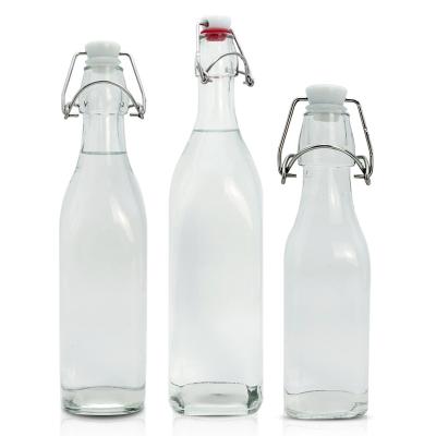 China Beverage Frosted 250ml 500ml 1000ml Clear Empty Round Beer Spirit Fruit Wine Glass Bottles With Swing Lid Flip Top Cap for sale