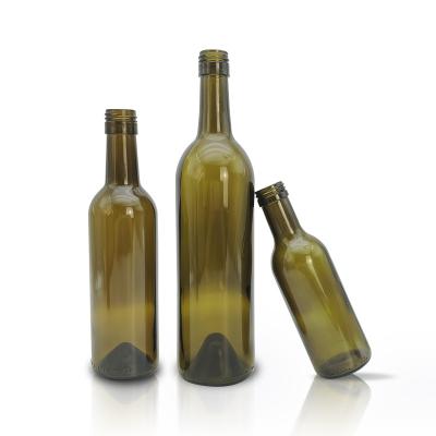 China 200ml 250ml 375ml 700ml stock factory empty green cheap glass beer bottles environment friendly with shrink wrap for sale