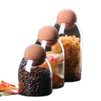 China 500ml 750ml 1200ml Food Coffee Storage Container Borosilicate Glass Jar With Ball Shaped Cork Lid for sale