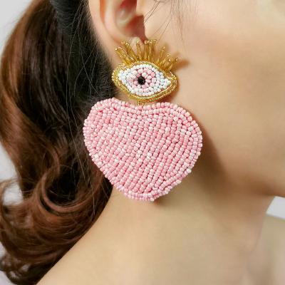 China 2021 BOHEMIA Gold Plated Lady Stud Drop Earrings Fashion Devil Red Heart Seed Beaded Eye Drop Earrings For Women Jewelry for sale