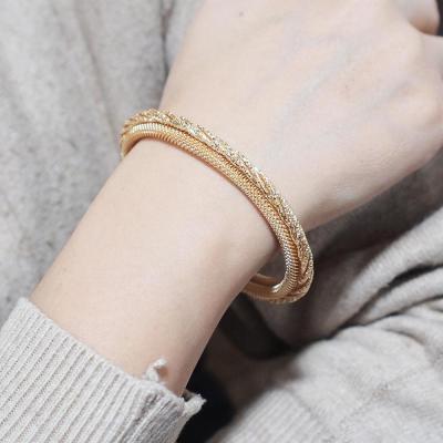 China Hot Selling Vintage HANSIDON Jewelry Fashion Creative Mesh Elastic Stretch Bangles For Women Dubai Jewelry Gold Color Cuff Bangle for sale