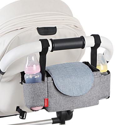 China Universal Multifunctional Portable Baby Stroller Hanging Organizer With Pockets Quality Non Slip Strap Multiple Stroller Organizer Diaper Bag for sale