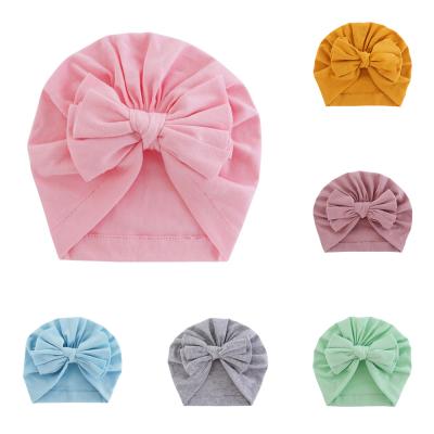 China European and American Solid Cute Bowknot Hats Cotton Baby Style Soft Soft Elastic Turban Hats for Newborn Baby Boy Girls Headwraps for sale