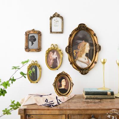 China Contemporary Luxury Retro Shabby Chic Resin Craft Decor Antiqued Carved Frame Home Decoration Wall Mirrors Art for sale