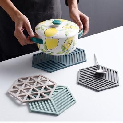 China Hexagon Durable Eco-Friendly Sustainable Dish Insulation Dining Table Coaster Silicone Ceramic Dining Table Mat for sale