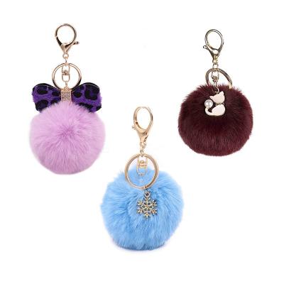 China Promotion Gift BSCI Disney Certified Pom Pom Wholesale Rainbow Fur Factory Fake Key Chain for sale