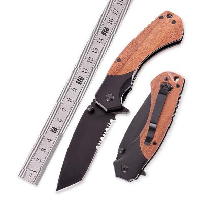 China Bubinga Design Outdoor Survival Camping Folding Hunting Knife Creative Wooden Black Half Handle Tooth for sale