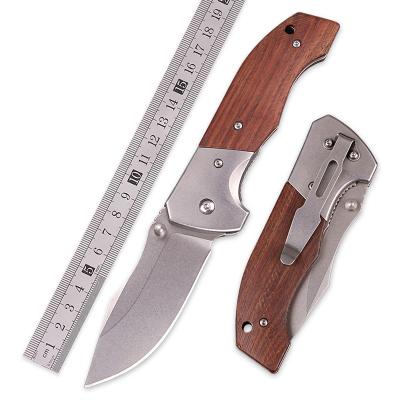 China Sharp And Durable Steel Wood Handle High Hardness Folding Head Outdoor Survival Hunting Knife With Back Clip for sale