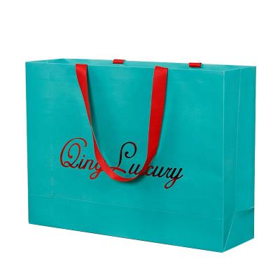 China Logo Design Bags Strong Kraft Handmade Customizable Gift Paper Bag Package Takeout Shopping Take Out Paper Bag for sale