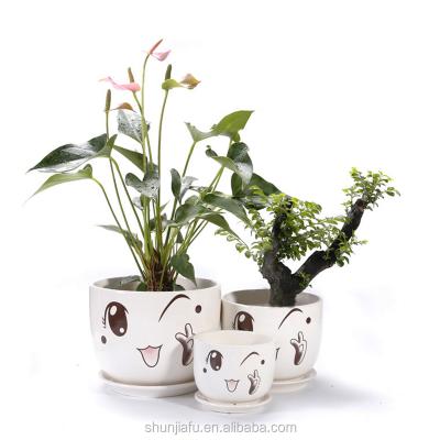 China Ceramic Plant Pottery Pot Sets Smiley Face Flower Pot Handmade Ceramic Cute Cartoon Sets for sale