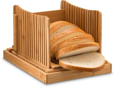 China Amazon Sales Kitchen Sustainable Bamboo Wooden Block Bread Slicer Wooden Bread Cutting Board With Crisper Holder for sale