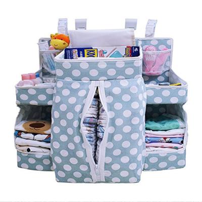 China Multi-pockets Large Baby Nursery Essential Storage Hutch Diaper Hanging Organizer For Crib for sale