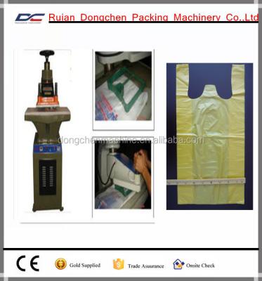 China Plastic LOW PRICE Manual Type T Shirt Bag Handle Punching Machine for sale