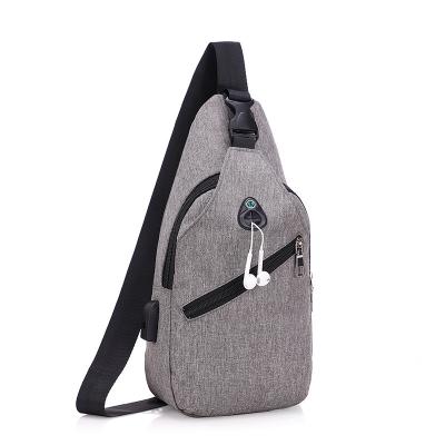 China Hot Selling Durable Oxford Front Zipper Sling Shoulder Bag Fashion Sling Material Bag With Earphone Hole for sale