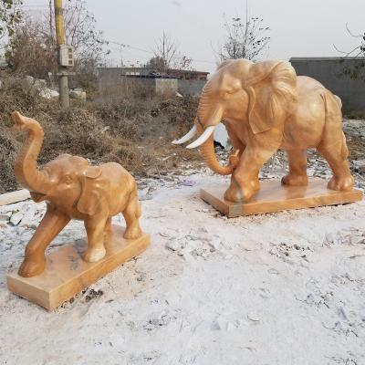 China Large Handmade Modern Natural Stone Yellow Stone Red Garden Elephant Sculpture Stone Elephant Sunset for sale