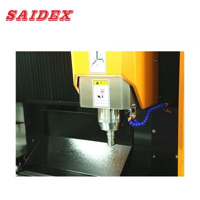 China Máquina CNC de escultura acrílica de 8KW 600x500x280mm Multifunção Adequada para processamento de alumínio, acrílico, PS、PC à venda