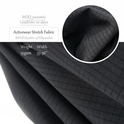 China Stretch Polyester Spandex Lattice Effect Stretch Sports T-shirt Sportswear Fabric Gently Check Fabric For Pants for sale