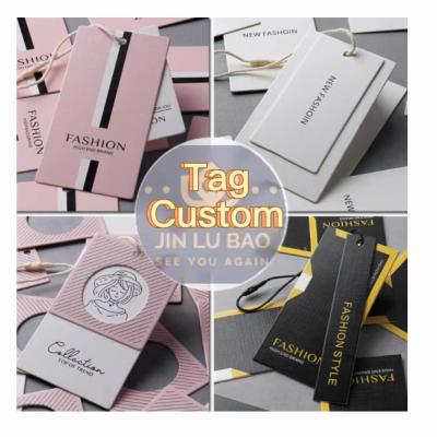 China Disposable Wholesale Custom Luxury Hang Tags Clothing Label Shape Wallpapering Special Tag Clothing for sale