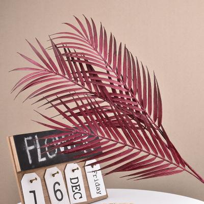 China Wholesale 68cm Real Touch Fake Palm Leaves Artificial Leaf Palm Leaves For Wedding Backdrop Decoration for sale