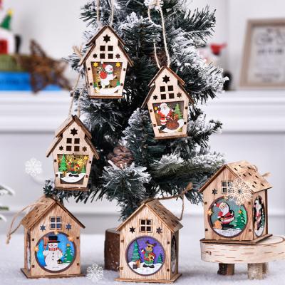 China 2021 Eco-friendly Hot-selling Wooden Christmas House Christmas Villages With Light For Christmas Decoration Supplies for sale