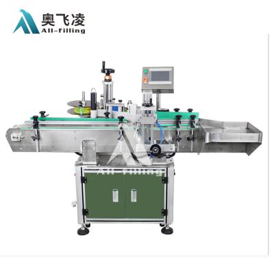 China Automatic Beverage Glass Bottle Small Circle Around Adhesive Stick Labeling Machine / Labeling Machine for sale