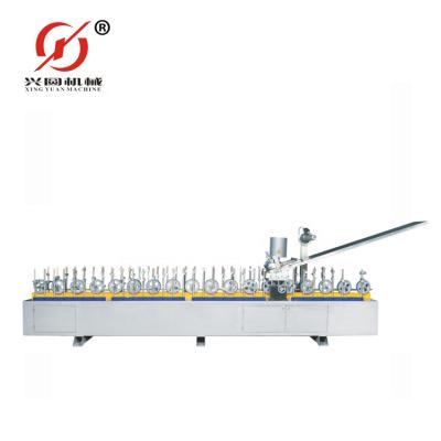 China Other Guangzhou Xingyuan EVA Hotmelt Glue Veneer Profile Wrapping Machine For Door Frame for sale