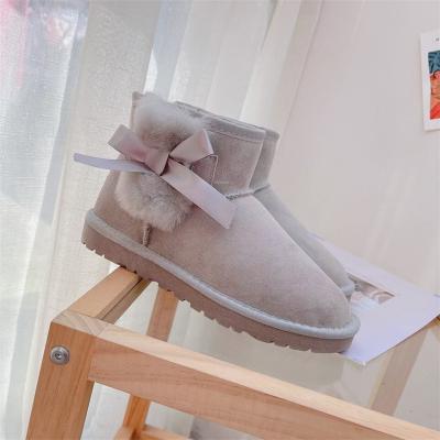 China Non-slip Breathable Lady Sheep Fur One Body Short Tube Snow Uggging Cotton Flat Thick Warm Shoes Bow Short Boots Leather for sale