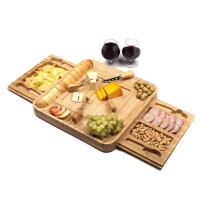 China Sustainable Bamboo Cheese Board with Stainless Steel Cutlery Set and Slide-Out 2 Drawer for sale