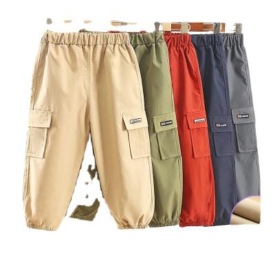 China Wholesale Cheap Breathable Spring Solid Color Sports Suits Kids Pocket Style Loose Boy's Wear-Resistant Pants Trousers for sale