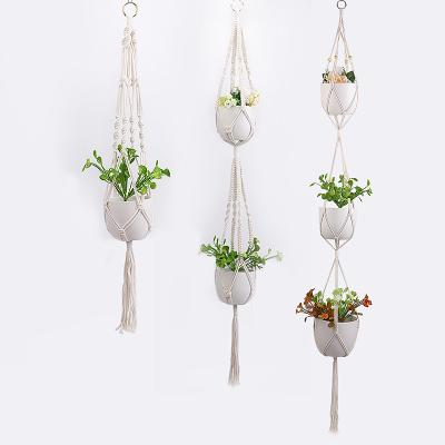 China Handmade Macrame Plant Hanger Indoor Macrame Hanging Planters Beads Single Tier Macrame Plant Hanger Plant Hanging Racks for sale